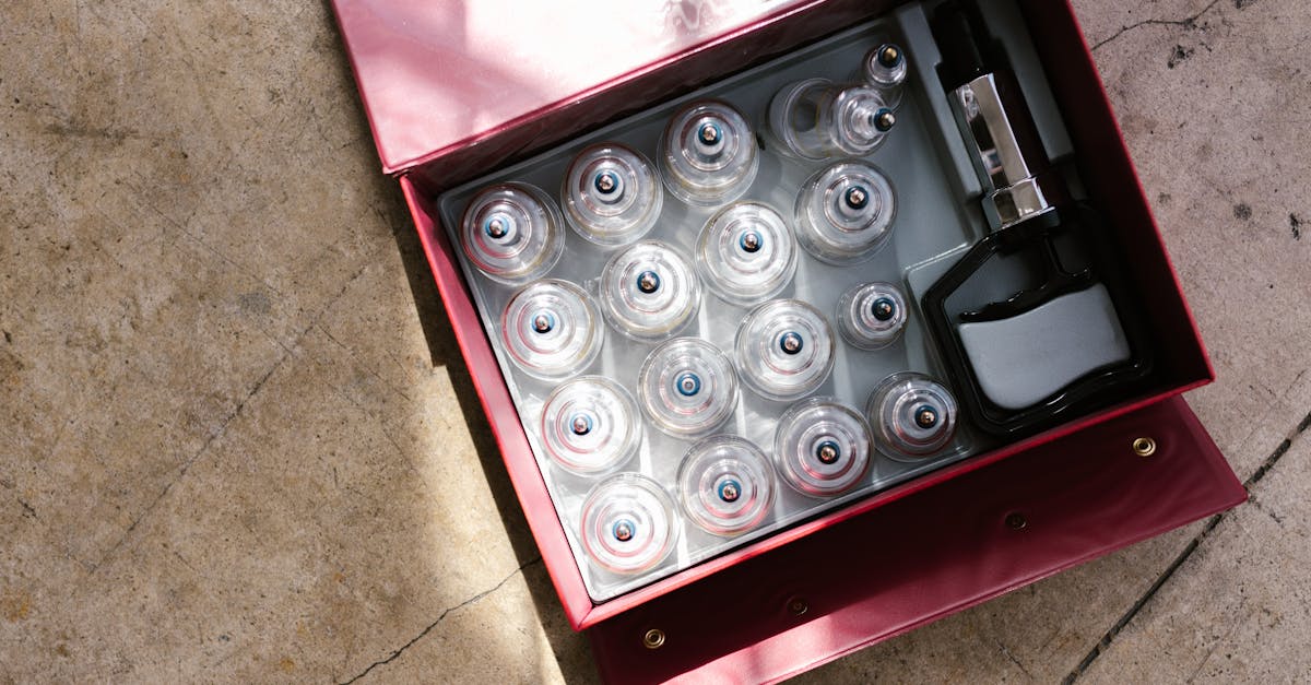 pexels-photo-8313420-8313420 A top view of a cupping therapy set within a red box, ideal for healthcare enthusiasts.
